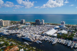 Aerial view of boats at the Fort Lauderdale International Boat Show, with high rise hotels and the beach in the background | Credit Felix Mizioznikov on Shutterstock