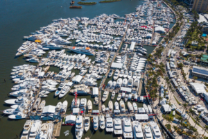 Aerial shot of thousands of boats in the water, docked close together at Palm Beach International Boat Show | South Florida Aerials on Shutterstock