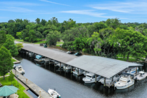 Drone Shot of Lighthouse Marina Jax, with boats docked and a cover structure over the docks