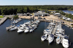 birds eye view of Three Mile Harbor Marina with boats filling the docks on a sunny day